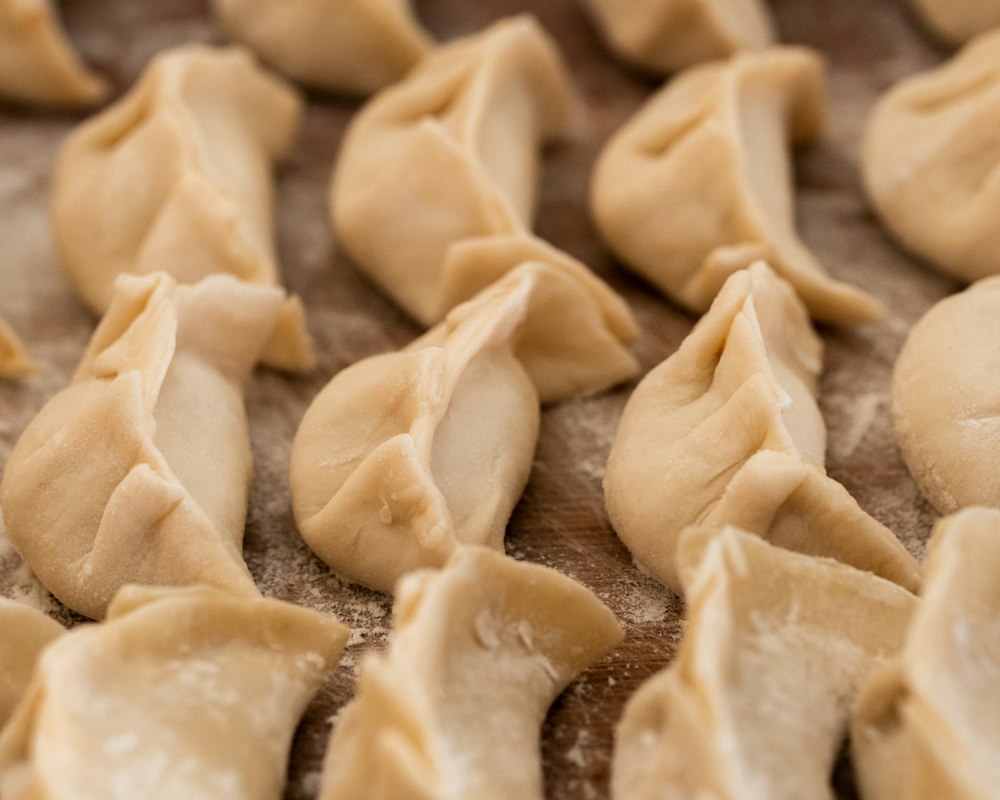 Rows of hand-folded momos