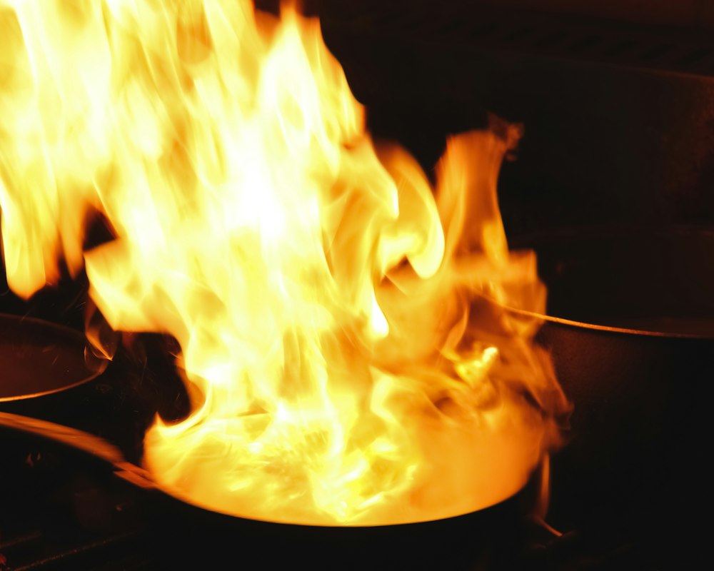 Flames leaping from a wok